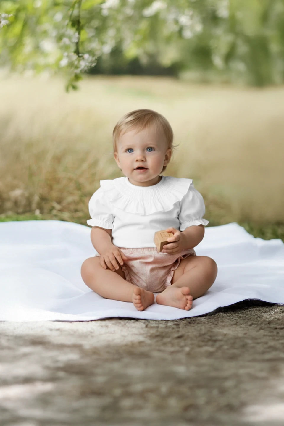 Braguita cubrepañal blanco y rosa